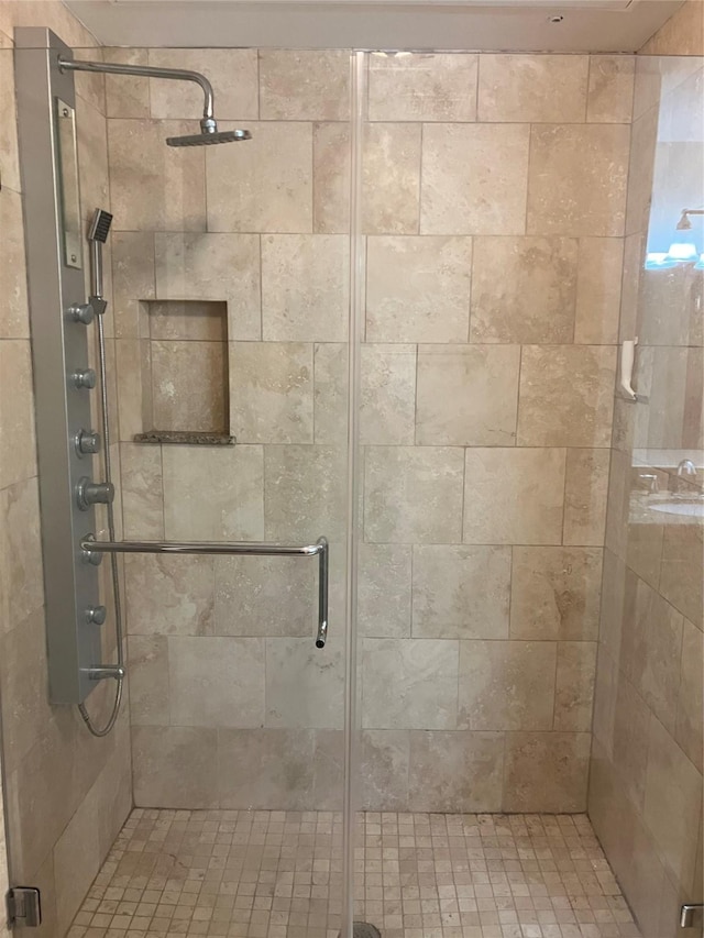 bathroom featuring a shower stall