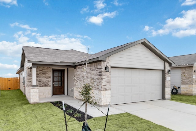 ranch-style home featuring a garage, driveway, brick siding, fence, and a front yard