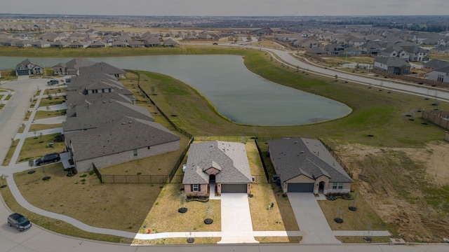 bird's eye view featuring a residential view and a water view