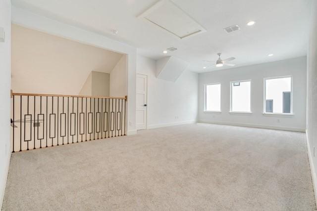 spare room featuring baseboards, recessed lighting, carpet floors, visible vents, and ceiling fan