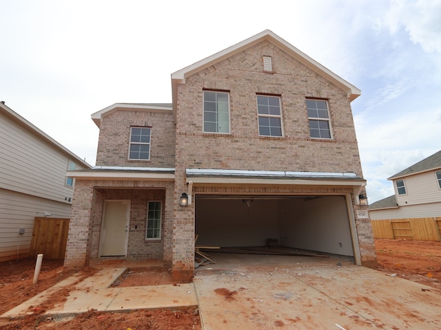 9738 Fuller Frk, Montgomery, TX 77316 - view of front facade with brick siding, driveway, and an attached garage