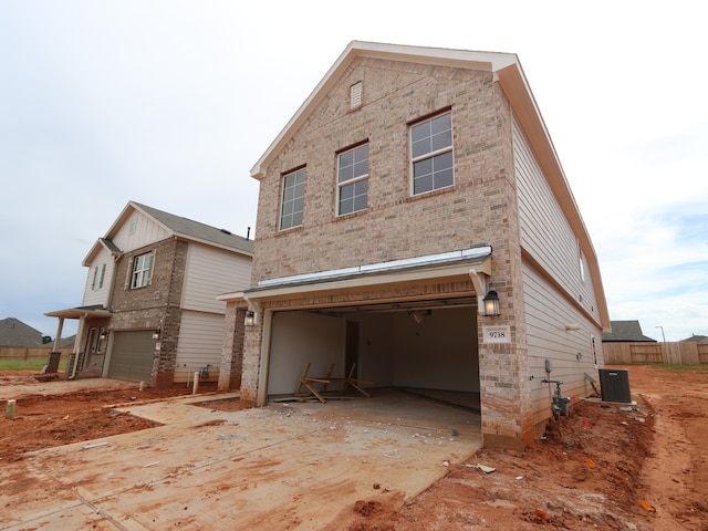9738 Fuller Frk, Montgomery, TX 77316 - view of side of home with an attached garage, concrete driveway, and brick siding
