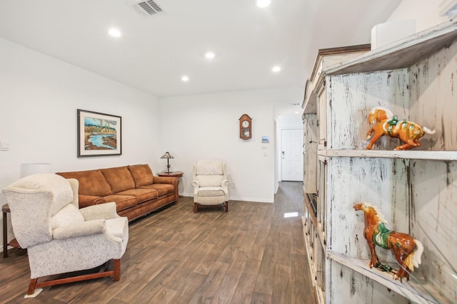 living room featuring recessed lighting, dark wood-style flooring, visible vents, and baseboards