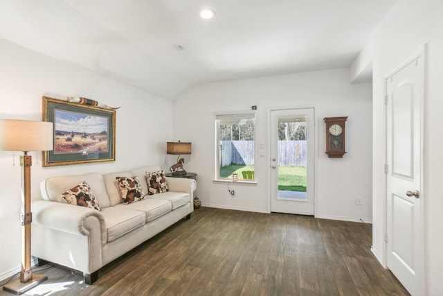 living room featuring lofted ceiling, baseboards, dark wood finished floors, and recessed lighting