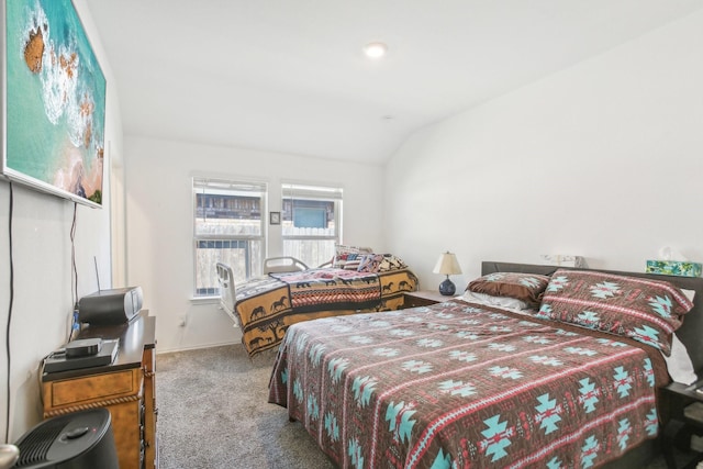 carpeted bedroom featuring vaulted ceiling