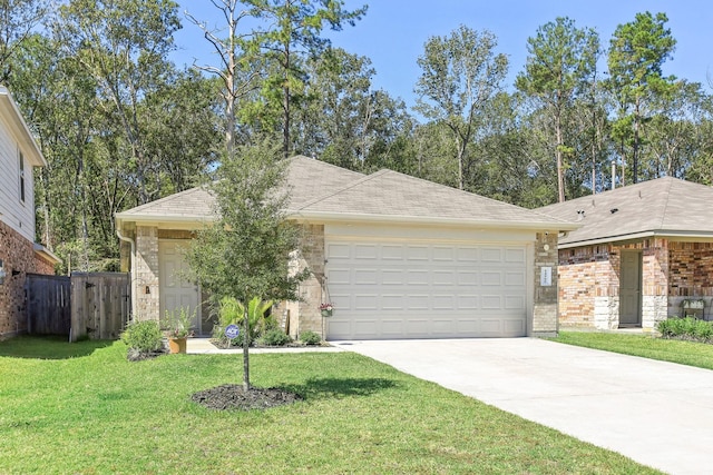 ranch-style home featuring a garage, concrete driveway, a front yard, and fence