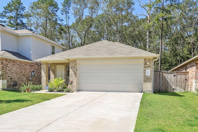 view of front of house featuring a front lawn, concrete driveway, an attached garage, and a gate