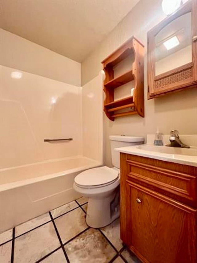 full bath featuring toilet, shower / bathtub combination, tile patterned floors, and vanity