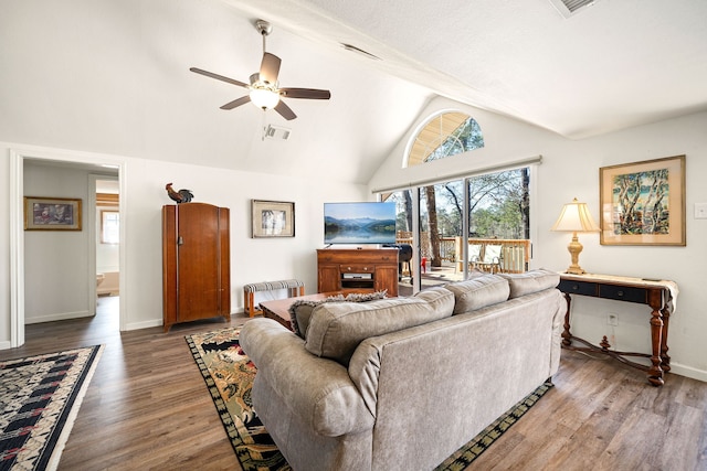 living room with baseboards, visible vents, a ceiling fan, wood finished floors, and high vaulted ceiling