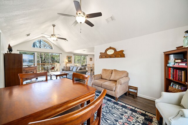 653 Terrace Trl, Goodrich, TX 77335 - dining space with wood finished floors, ceiling fan, and vaulted ceiling
