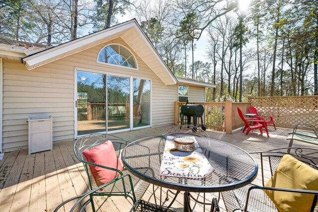 653 Terrace Trl, Goodrich, TX 77335 - deck featuring outdoor dining space and area for grilling