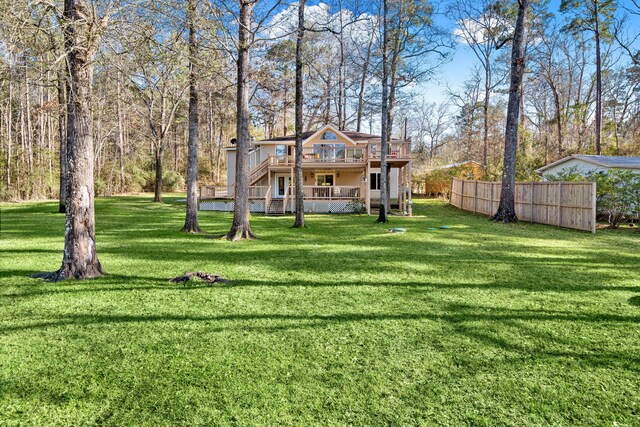 653 Terrace Trl, Goodrich, TX 77335 - rear view of property with a wooden deck and stairway