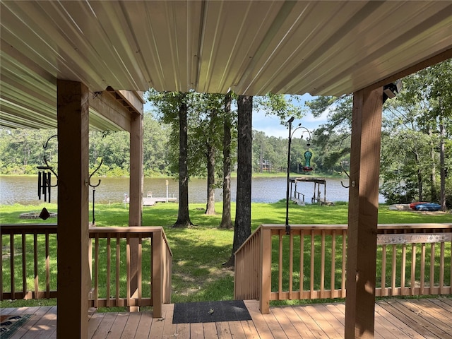 653 Terrace Trl, Goodrich, TX 77335 - wooden terrace with a water view, view of wooded area, and a lawn