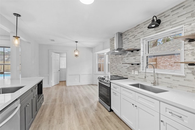 25511 Long Hill Ln, Spring, TX 77373 - kitchen with wall chimney range hood, a sink, decorative backsplash, stainless steel appliances, and light countertops