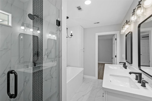 bathroom with marble finish floor, a shower stall, visible vents, and a sink