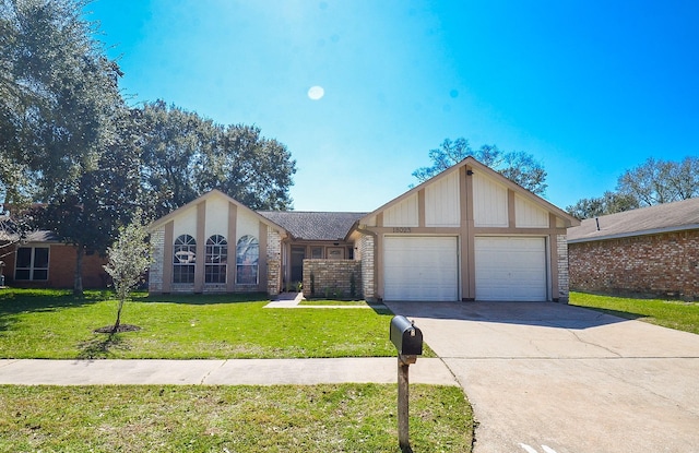 view of front of property with a garage, driveway, a front lawn, and brick siding