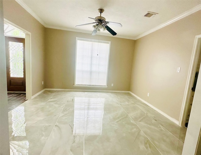 empty room with a ceiling fan, visible vents, crown molding, and baseboards