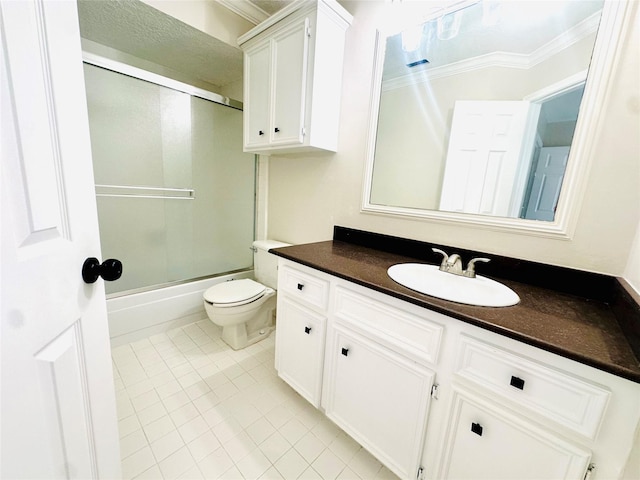 bathroom featuring tile patterned flooring, toilet, shower / bath combination with glass door, vanity, and crown molding