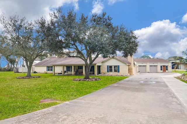 ranch-style house with a garage, concrete driveway, and a front lawn