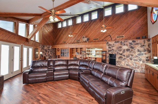 living room featuring plenty of natural light, visible vents, and wood finished floors