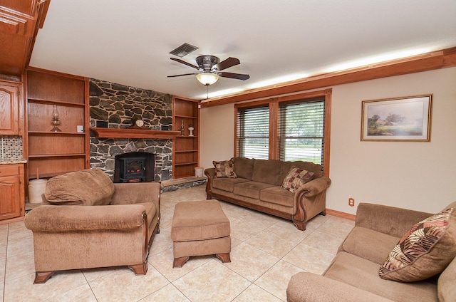 living room with light tile patterned floors, ceiling fan, and visible vents