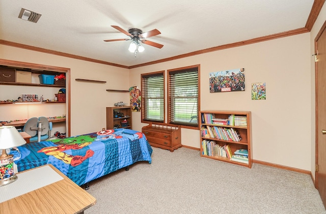 bedroom featuring carpet floors, baseboards, visible vents, and crown molding