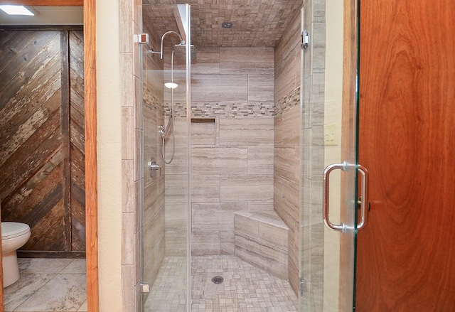 full bath with a shower stall and toilet