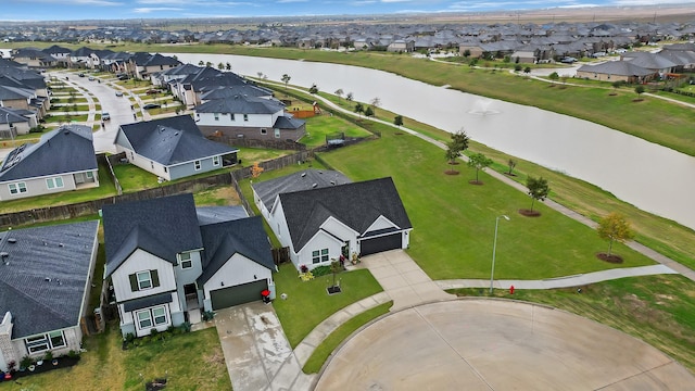 bird's eye view with a residential view and a water view