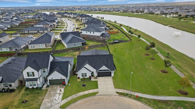 bird's eye view featuring a residential view and a water view