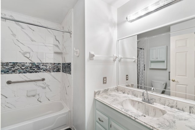 bathroom featuring toilet, shower / bath combo, and vanity