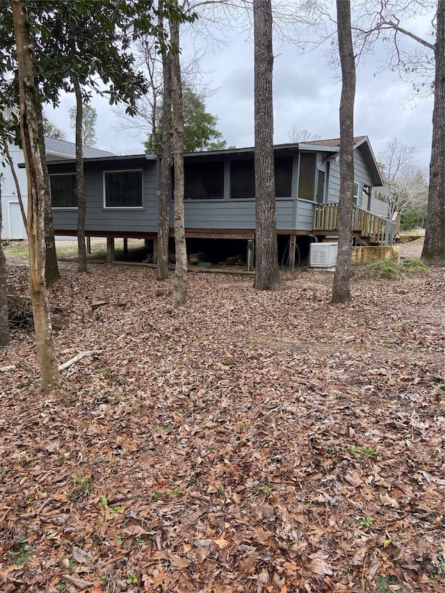 back of house with a sunroom