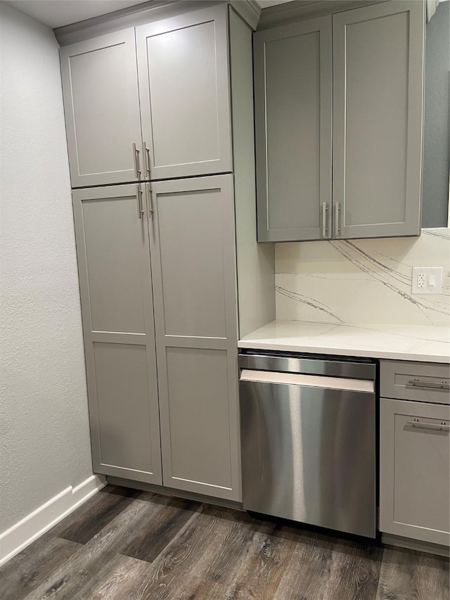 interior space featuring dark wood-style floors, dishwasher, and gray cabinetry