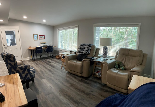 living area with recessed lighting, dark wood-style flooring, vaulted ceiling, and baseboards