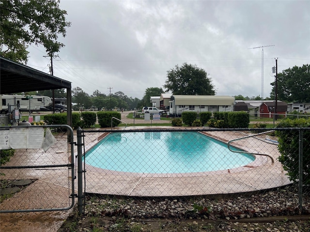 community pool with a gate and fence