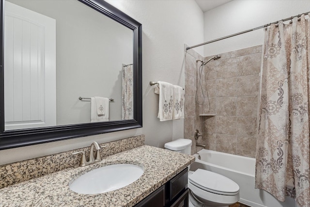 bathroom with toilet, shower / bath combo, and vanity