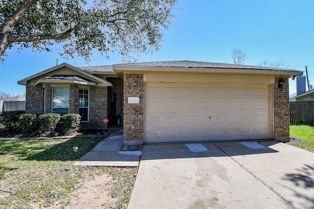 ranch-style house with concrete driveway, brick siding, an attached garage, and fence