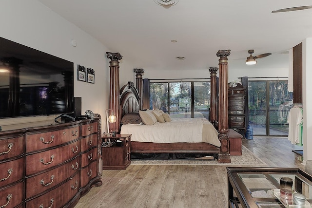 bedroom featuring access to exterior and light wood finished floors