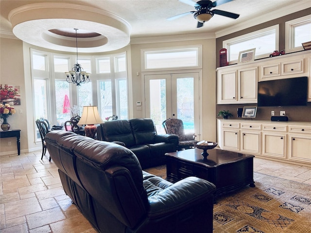 living room with french doors, crown molding, stone tile flooring, a raised ceiling, and baseboards