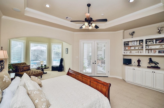 bedroom featuring light colored carpet, visible vents, access to outside, ornamental molding, and a tray ceiling