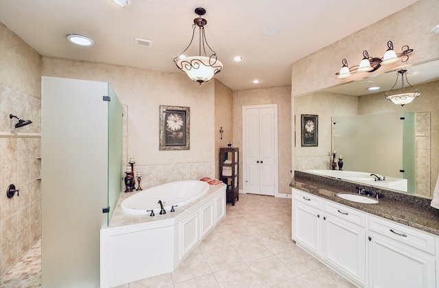 bathroom with tile patterned flooring, visible vents, a walk in shower, and a bath