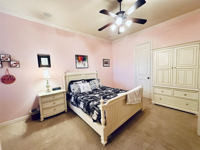 bedroom with light carpet, ceiling fan, baseboards, and crown molding