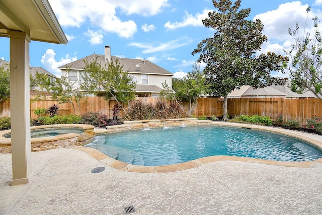 view of swimming pool featuring a patio area, a fenced backyard, and a pool with connected hot tub