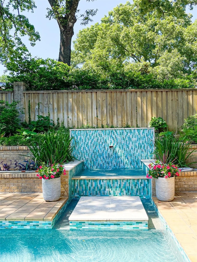 view of pool with fence