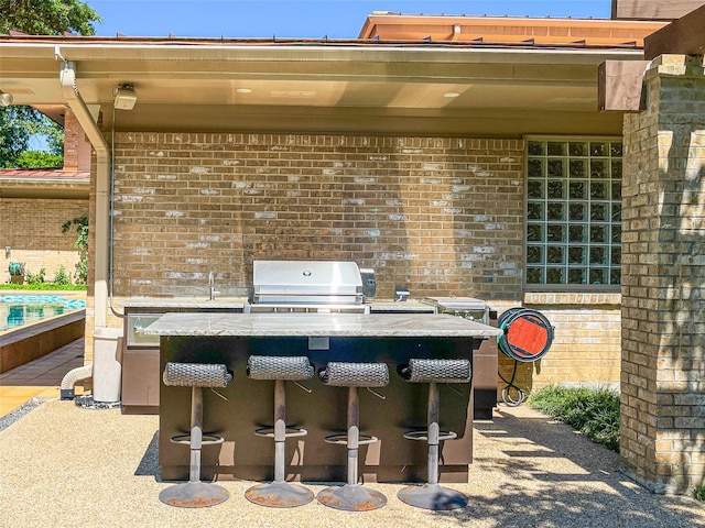 view of patio / terrace featuring grilling area and outdoor dry bar