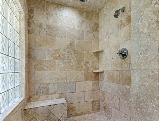 full bathroom with a tile shower