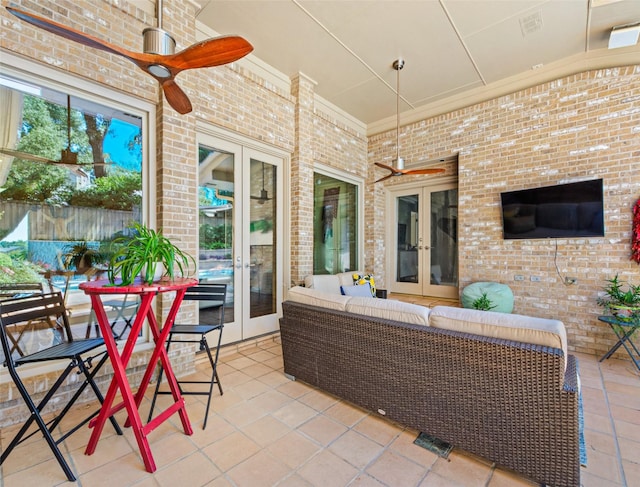 view of patio / terrace with french doors, outdoor lounge area, ceiling fan, and fence