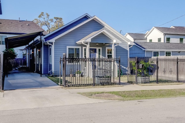 view of front of house featuring a fenced front yard and a gate