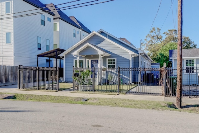 view of front facade with a fenced front yard and a gate