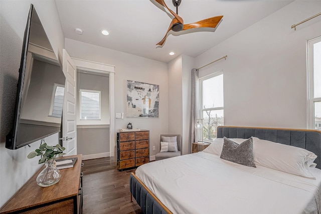 bedroom with dark wood-type flooring, recessed lighting, ceiling fan, and baseboards