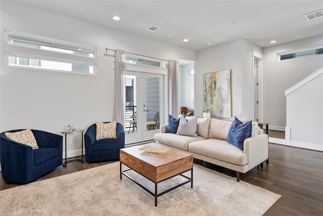 living area with recessed lighting, wood finished floors, visible vents, baseboards, and french doors